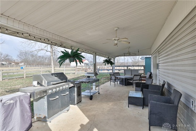view of patio with fence, a ceiling fan, outdoor dining area, and an outdoor living space