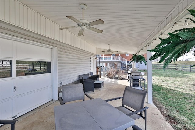 view of patio / terrace with fence, ceiling fan, and an outdoor hangout area
