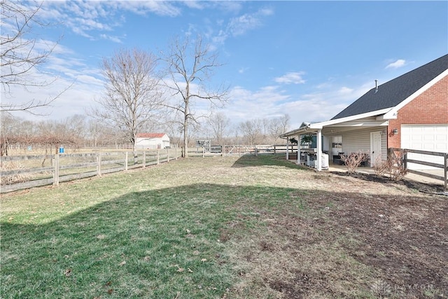 view of yard with a fenced backyard and an attached garage