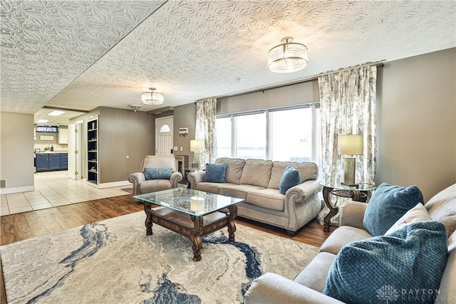 living area with wood finished floors and baseboards