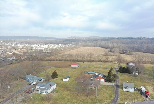birds eye view of property with a rural view