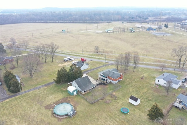 birds eye view of property with a rural view
