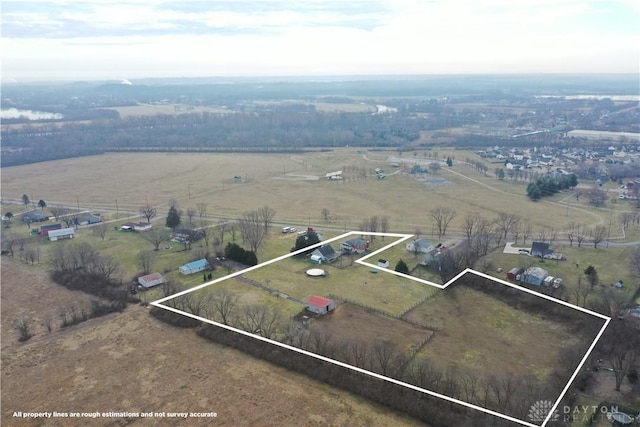 birds eye view of property with a rural view