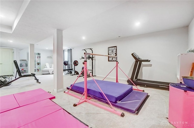 workout room featuring recessed lighting and light colored carpet