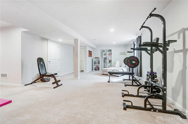 workout area featuring light carpet, baseboards, and recessed lighting