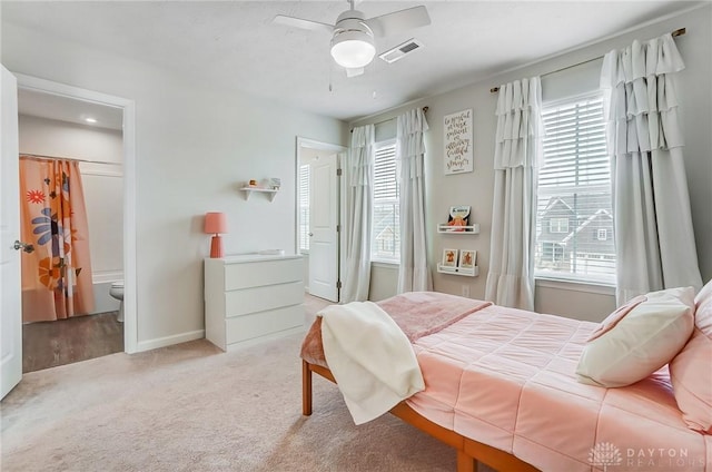 bedroom with light carpet, baseboards, visible vents, and ceiling fan