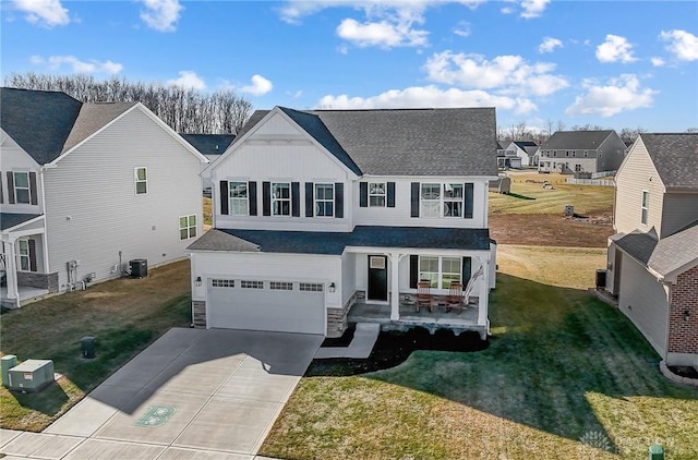 view of front of home featuring concrete driveway, a garage, a residential view, stone siding, and a front lawn