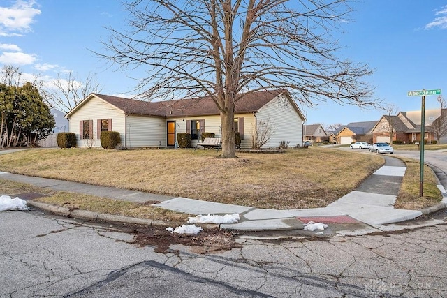 view of front of property with a front yard and a residential view