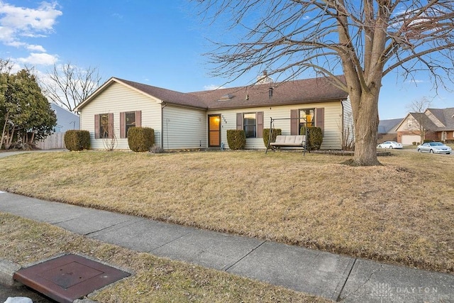 single story home with a front yard