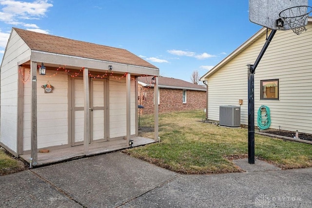 exterior space featuring an outbuilding and a lawn