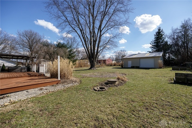 view of yard with an outbuilding and a deck