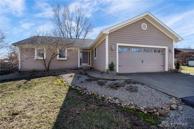 ranch-style home featuring concrete driveway and an attached garage