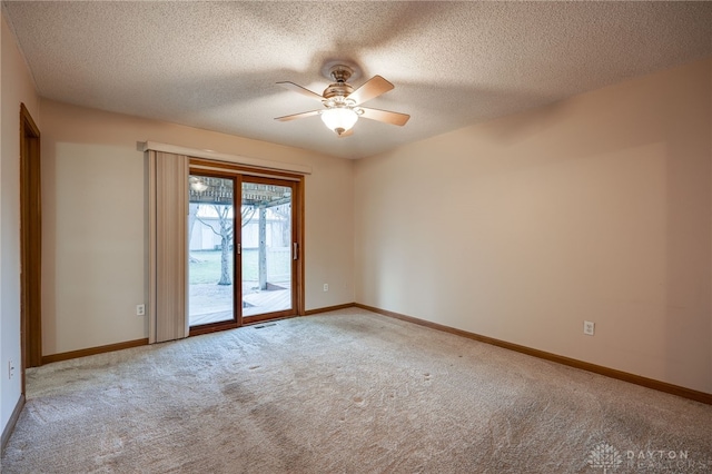 unfurnished room with a ceiling fan, a textured ceiling, baseboards, and carpet flooring