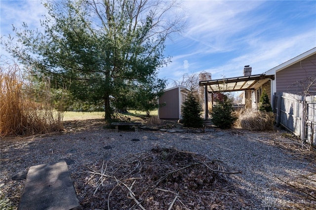 view of yard with a storage shed and an outdoor structure