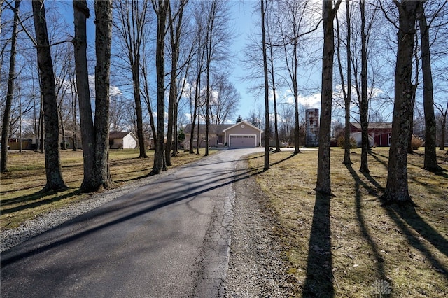 view of street with aphalt driveway