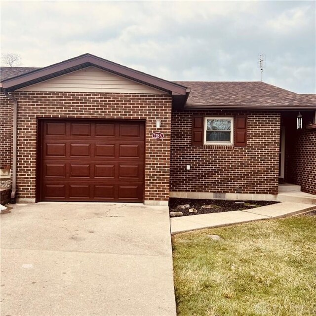 1181/2 Springlake Ave Middle, Unit Middle, Hillsboro, OH 45133 - single story home featuring concrete driveway, brick siding, a garage, and a shingled roof