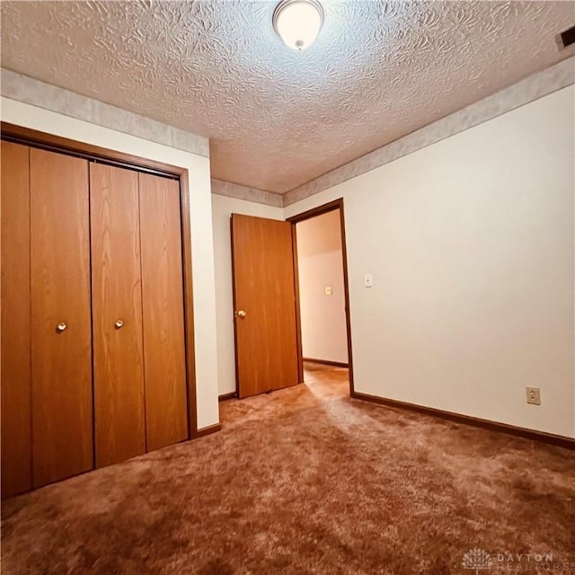 1181/2 Springlake Ave Middle, Unit Middle, Hillsboro, OH 45133 - unfurnished bedroom featuring carpet floors, a closet, and a textured ceiling