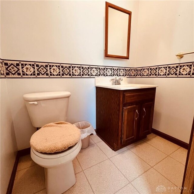 1181/2 Springlake Ave Middle, Unit Middle, Hillsboro, OH 45133 - half bath featuring vanity, a wainscoted wall, and tile walls