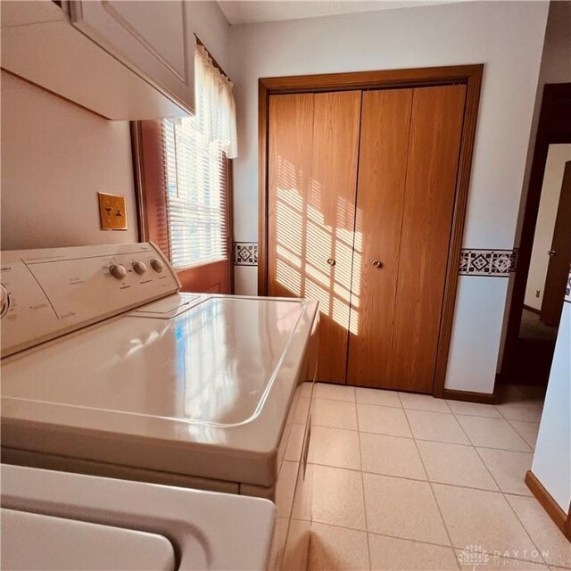 1181/2 Springlake Ave Middle, Unit Middle, Hillsboro, OH 45133 - laundry room featuring washer / dryer, light tile patterned floors, and cabinet space