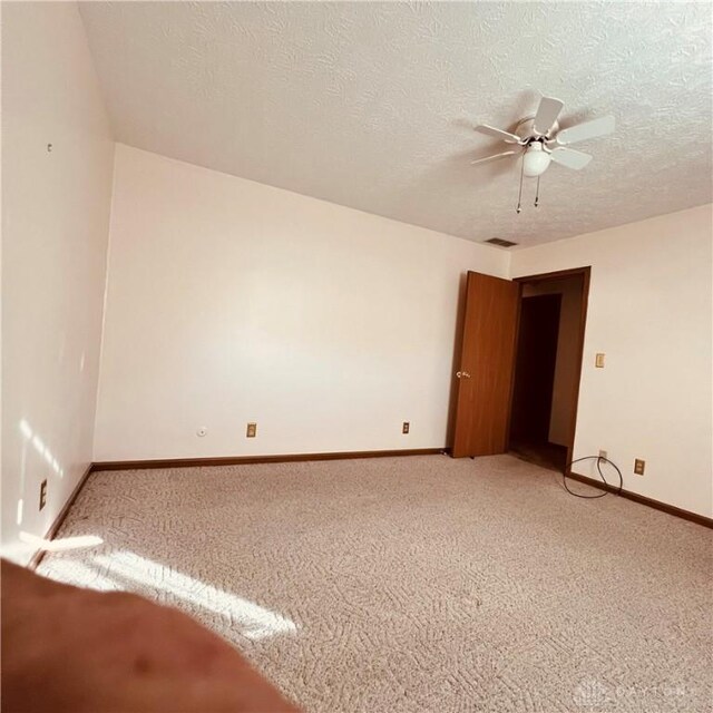 1181/2 Springlake Ave Middle, Unit Middle, Hillsboro, OH 45133 - unfurnished room with light carpet, ceiling fan, and a textured ceiling