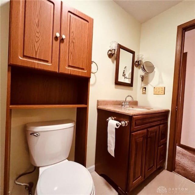 bathroom featuring toilet and vanity