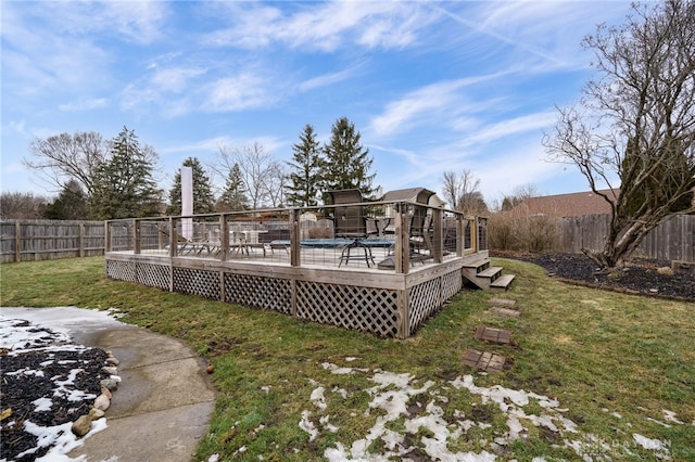 view of yard featuring a fenced backyard and a deck