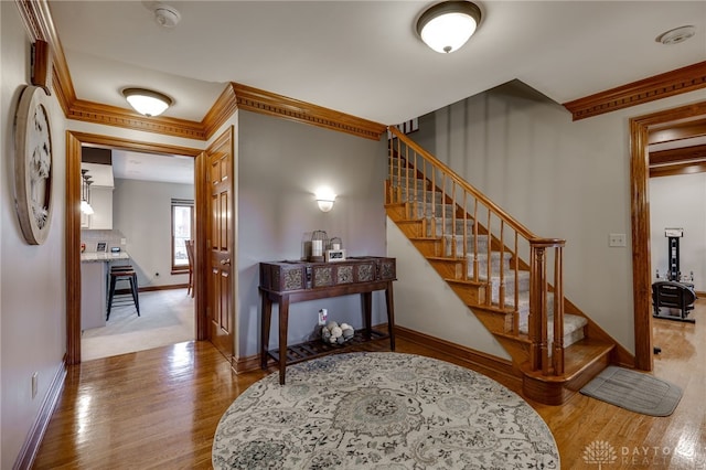 interior space featuring wood finished floors and baseboards