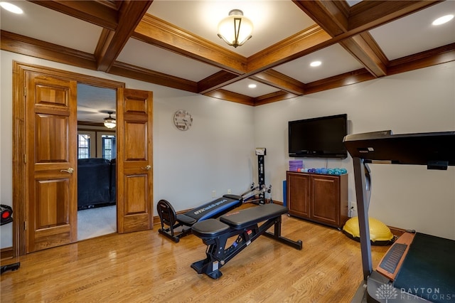 exercise room featuring light wood-style flooring, coffered ceiling, and recessed lighting