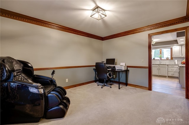 home office with ornamental molding, light colored carpet, and baseboards