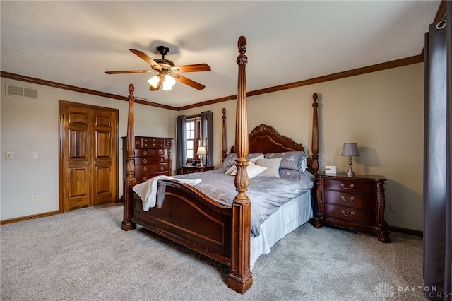 bedroom featuring visible vents, baseboards, a ceiling fan, ornamental molding, and carpet