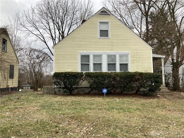 view of home's exterior featuring a lawn