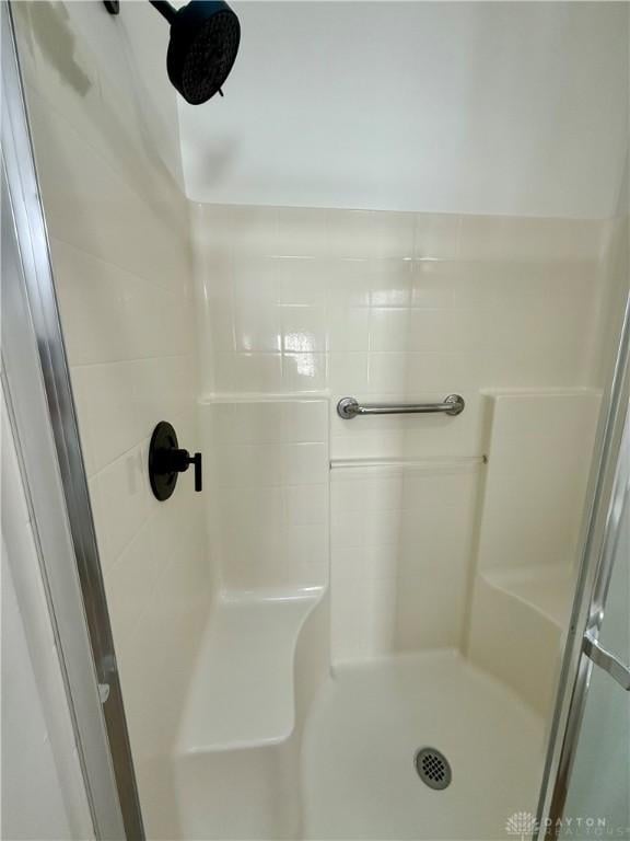 bathroom with a shower stall