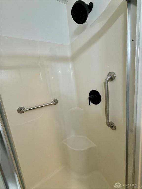 room details featuring a shower stall