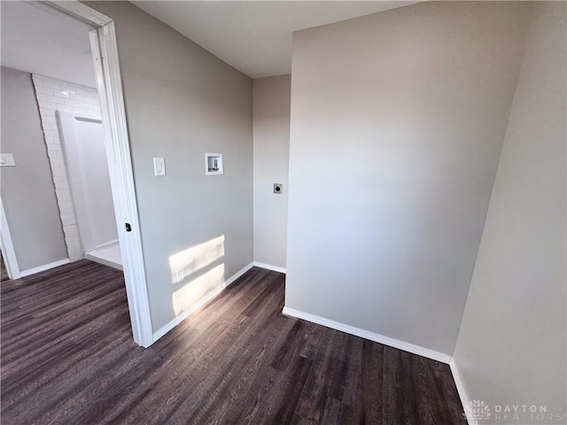 laundry room with hookup for a washing machine, laundry area, baseboards, dark wood finished floors, and electric dryer hookup