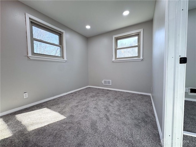 unfurnished room featuring recessed lighting, carpet flooring, visible vents, and baseboards