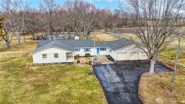 ranch-style house with a front yard, driveway, and an attached garage