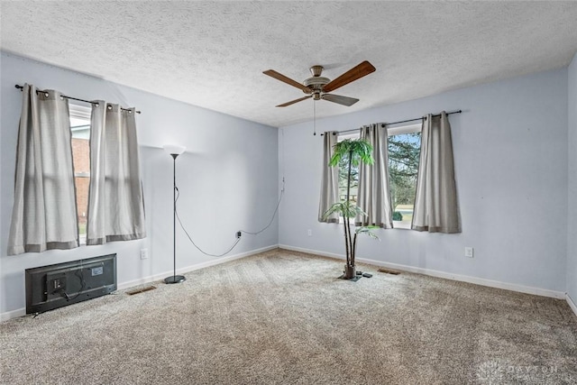 interior space featuring baseboards, visible vents, and carpet flooring