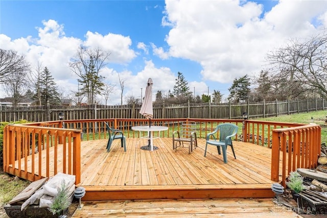 deck with a fenced backyard