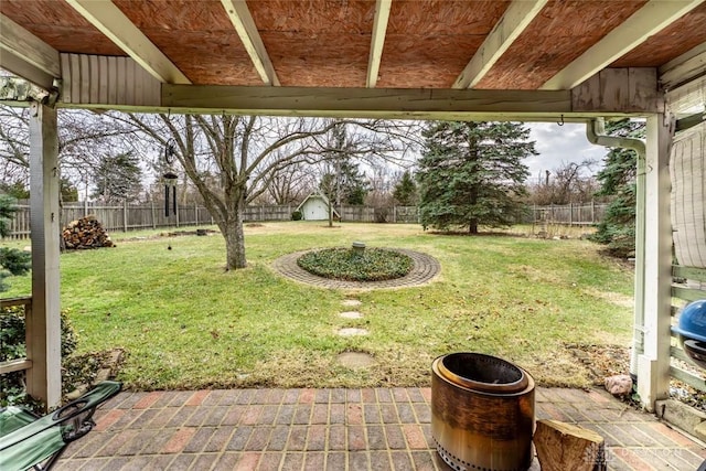 view of yard featuring a patio area and a fenced backyard