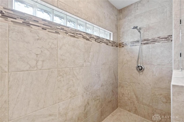 bathroom featuring tiled shower