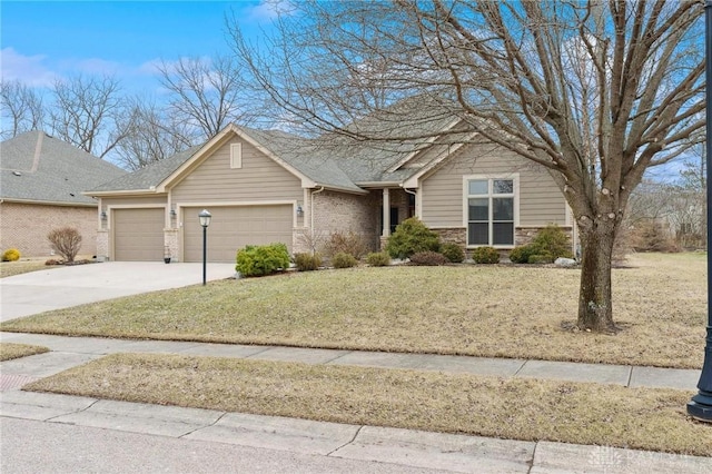 view of front facade with a front lawn, concrete driveway, stone siding, and an attached garage