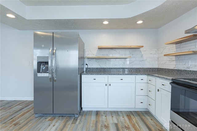 kitchen with white cabinetry, light wood-style flooring, stainless steel fridge with ice dispenser, and open shelves