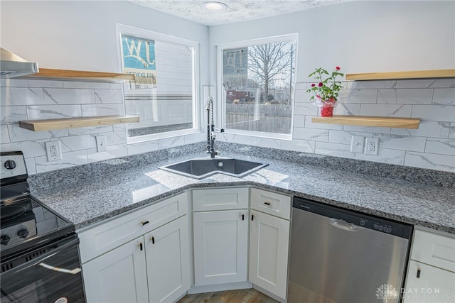 kitchen featuring dishwasher, open shelves, black range with electric stovetop, and a sink