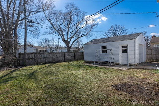 view of yard with an outbuilding and a fenced backyard