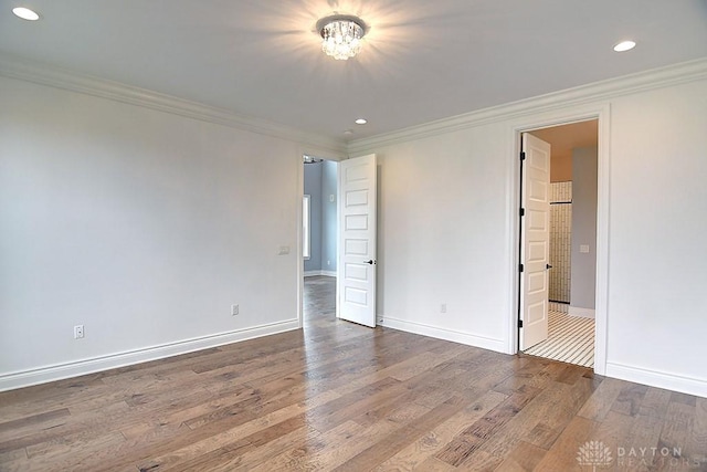 9471 Banyan Ct, Dayton, OH 45458 - unfurnished bedroom with crown molding, baseboards, and wood finished floors