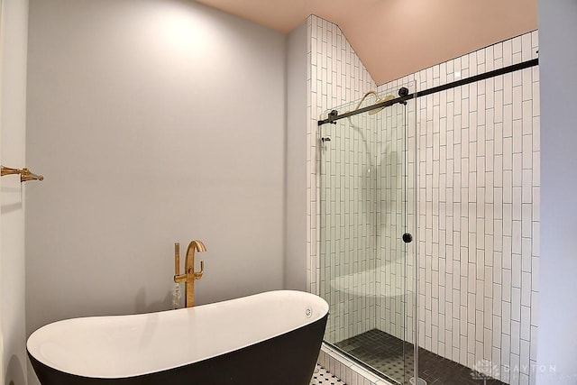 9471 Banyan Ct, Dayton, OH 45458 - bathroom featuring a stall shower and a soaking tub