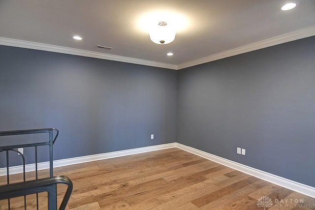 9471 Banyan Ct, Dayton, OH 45458 - empty room with ornamental molding, wood finished floors, visible vents, and baseboards