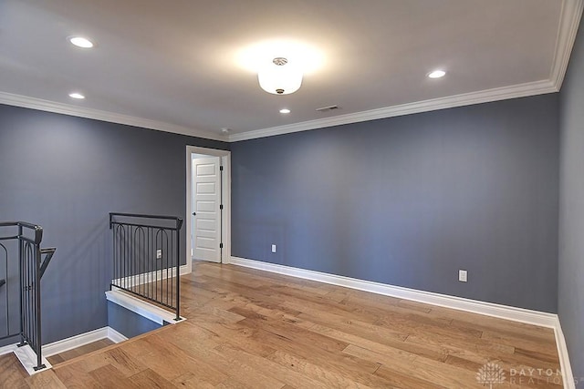 9471 Banyan Ct, Dayton, OH 45458 - spare room featuring light wood-type flooring, baseboards, and crown molding