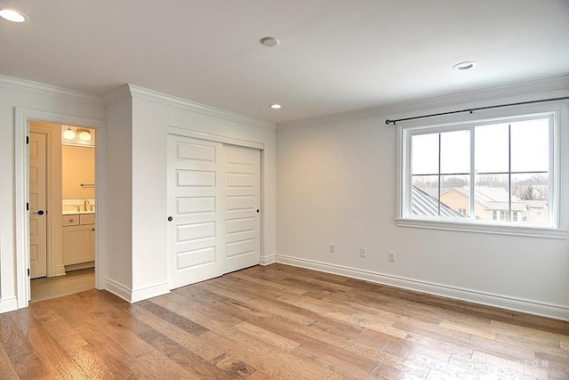 9471 Banyan Ct, Dayton, OH 45458 - unfurnished bedroom with baseboards, light wood-style flooring, crown molding, a closet, and recessed lighting