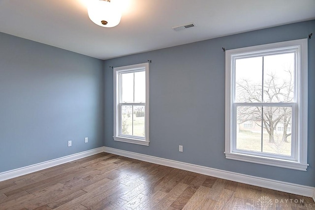 9471 Banyan Ct, Dayton, OH 45458 - spare room featuring visible vents, baseboards, and wood finished floors